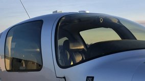 Cockpit Exterior of a Single Engine Piston Airplane - Cirrus SR22 - Powered by Shutterstock - Get 15% off with code: PIKWIZARD15