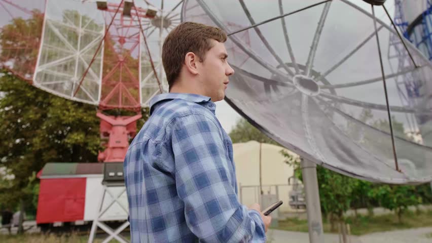 Radio telescope designer working on innovative solutions to improve the accuracy and sensitivity of equipment.