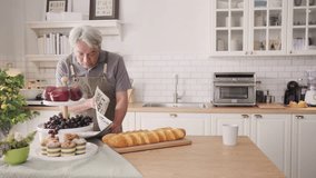 Happy Senior Asian couple doing sweet food at home - Powered by Shutterstock - Get 15% off with code: PIKWIZARD15
