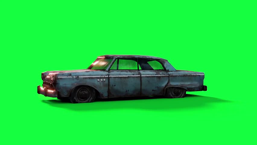 An old, rusted classic car on a green screen