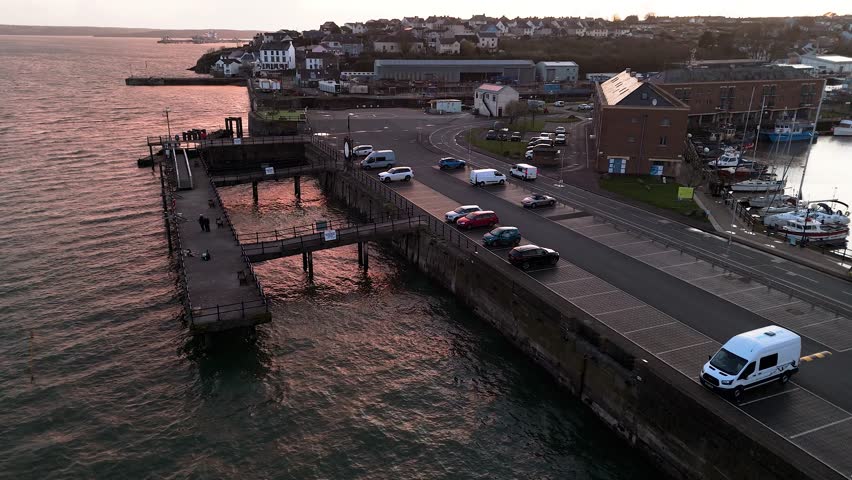 Scenic view of Milford Waterfront in Pembrokeshire with cars parked along the pier