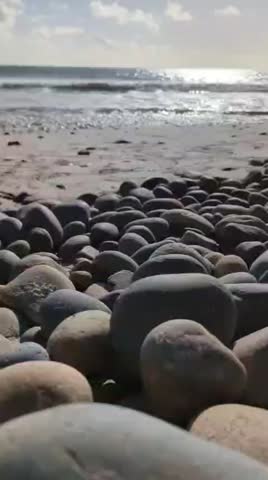 Waves on the beach with rocks