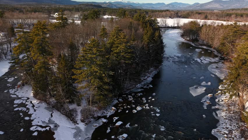 Fly with me above the Conway New Hampshire city shape during winter time and see the famous covered bridges 