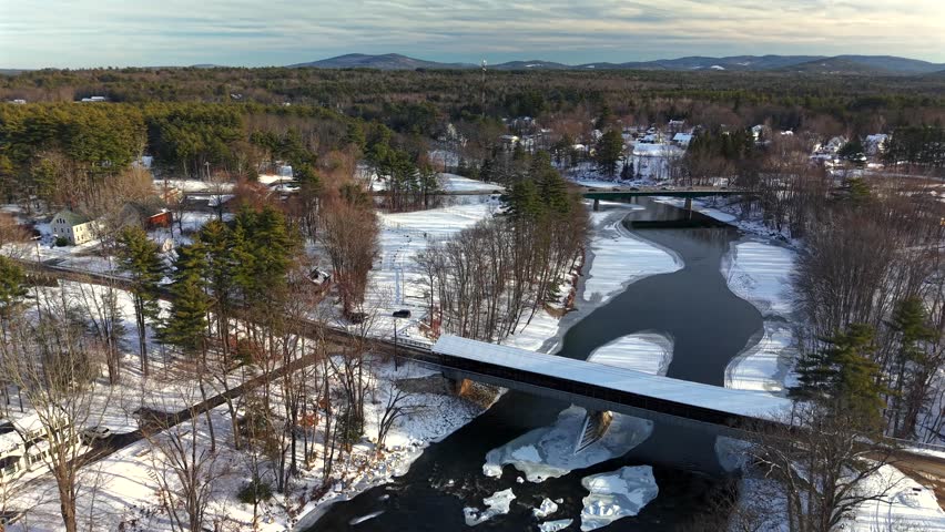 Fly with me above the Conway New Hampshire city shape during winter time and see the famous covered bridges 