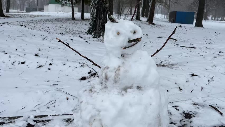 a snowman on the embankment of the city of Zhlobin, Republic of Belarus, in winter