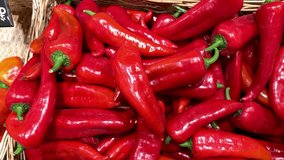 Vibrant red bell peppers are abundant in a market basket, showcasing their freshness and vivid color. Close-up. - Powered by Shutterstock - Get 15% off with code: PIKWIZARD15