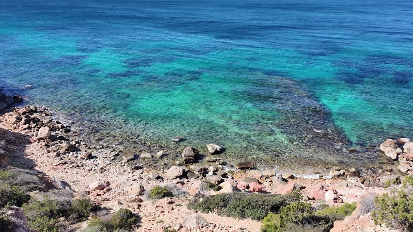 Vouliagmeni, Attica, Greece - March 5th, 2025 - parks, coastline, beach, town and aerial footage