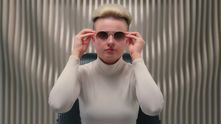 Caucasian fashion woman on neon futuristic background cyberpunk virtual reality gaming metaverse sci-fi fashionable girl confident female businesswoman model wear sunglasses trend stylish eyeglasses