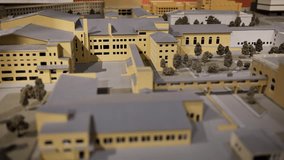 Architectural scale model showing a university campus project with buildings and trees - Powered by Shutterstock - Get 15% off with code: PIKWIZARD15