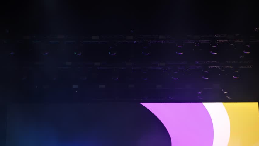 Bright green laser beams illuminating dark concert hall during music show