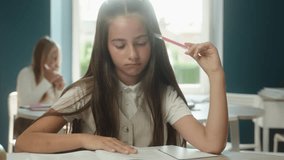 Caucasian little girl teen child kid daughter reading book sad schoolgirl pupil school student read library studying learning textbook boring literature education homework exam lesson classroom nerd - Powered by Shutterstock - Get 15% off with code: PIKWIZARD15