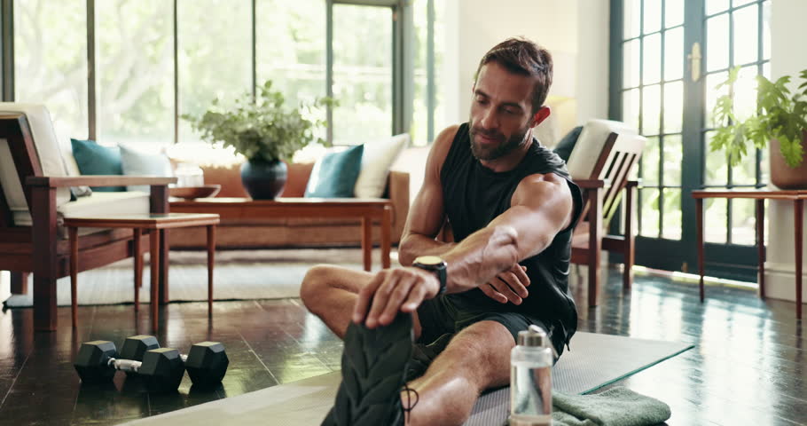 Home, man and fitness with legs for stretching, physical activity and wellness with morning routine. House, male person and warm up with balance for exercise, workout and flexibility with endurance