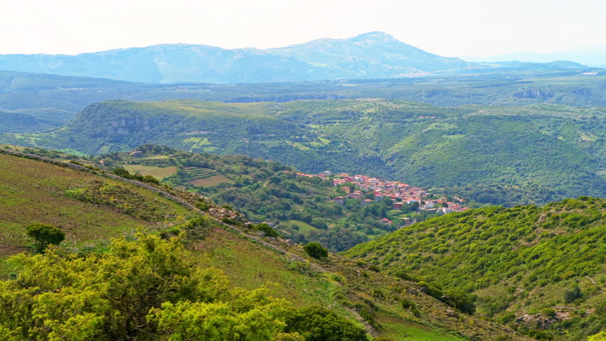 Seulo, Sardinia mountain view on small village town at sunset dusk in Italy, beautiful scenic landscape of longevity blue zone