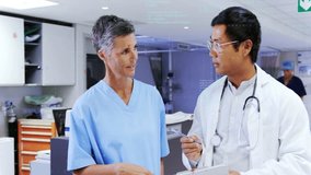 Discussing patient data, medical professionals in hospital corridor with animation overlay. Healthcare, technology, innovation, collaboration, digital, team - Powered by Shutterstock - Get 15% off with code: PIKWIZARD15