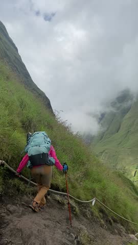 female hikers walk on a rugged hiking trail perfect for thrill-seekers and nature enthusiasts. The Torean trail, often called the Jurassic Park trail 