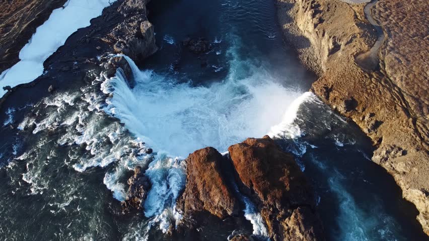 Tilt down of one of the most beautiful waterfalls in Iceland - Godaffoss - "Waterfall of the Gods", Iceland.