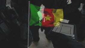 Examining equipment, military personnel with Cameroon flag in school animation scene. defense, analysis, training, education, Africa - Powered by Shutterstock - Get 15% off with code: PIKWIZARD15
