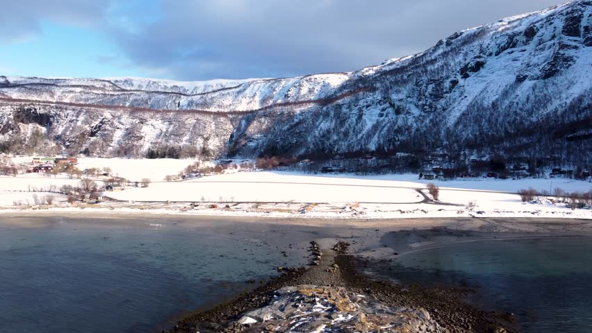 Capture the magic of winter with this 4K aerial video of Bodø, Norway. Snowy mountains, icy fjords, and pristine landscapes make this footage perfect for any project.