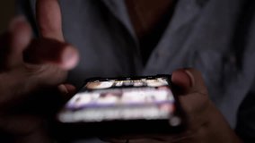 Woman using smartphone in the dark, scrolling and browsing. Great for projects related to mobile technology and social media engagement. - Powered by Shutterstock - Get 15% off with code: PIKWIZARD15