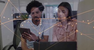 Analyzing tablet data, diverse professionals in office with digital animation overlay. Technology, teamwork, brainstorming, innovation, collaboration, digital transformation - Powered by Shutterstock - Get 15% off with code: PIKWIZARD15