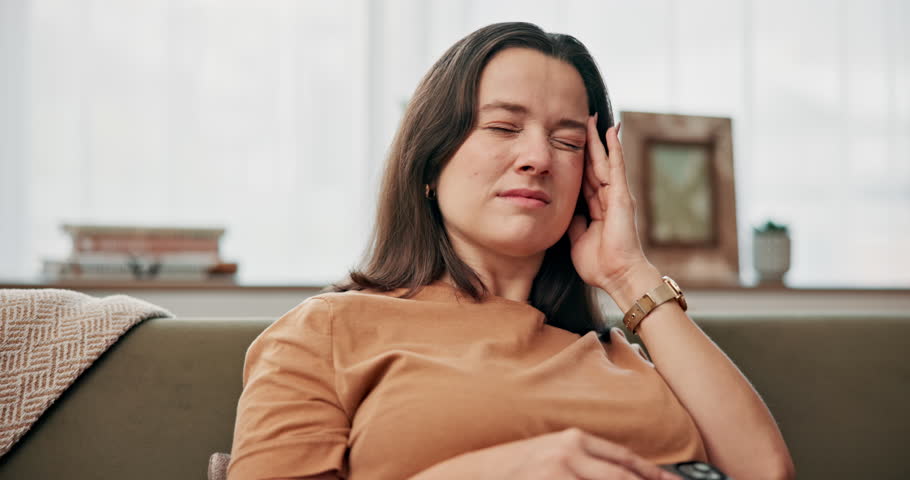 Phone, pregnant and woman with headache, pain and mental health of sick future mom in home. Stress, pregnancy and tired person with migraine, fatigue or massage temples with discomfort in living room