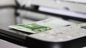 100 euro banknote on flat bed scanner with light moving above it - Powered by Shutterstock - Get 15% off with code: PIKWIZARD15