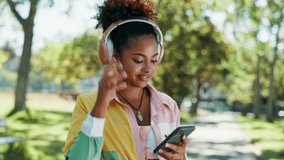 Nature, cellphone and woman with headphones outdoor in park listening to music online. Happy, phone and female person streaming playlist, podcast or radio on app with audio tech in public garden - Powered by Shutterstock - Get 15% off with code: PIKWIZARD15