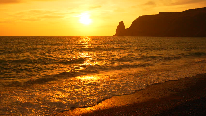Aerial view Sunset Sea Cliffs Crimea: Golden hour ocean waves crash against dramatic coastline during picturesque evening.