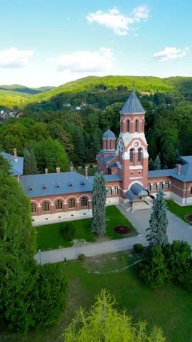 Episcopal church of Curtea de Arges. Drone track right. famous travel destination in Romania. Aerial perspective. Vertical footage.