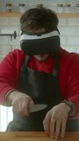 Virtual reality cooking experiment with a blindfolded chef using a knife, vertical video - Powered by Shutterstock - Get 15% off with code: PIKWIZARD15