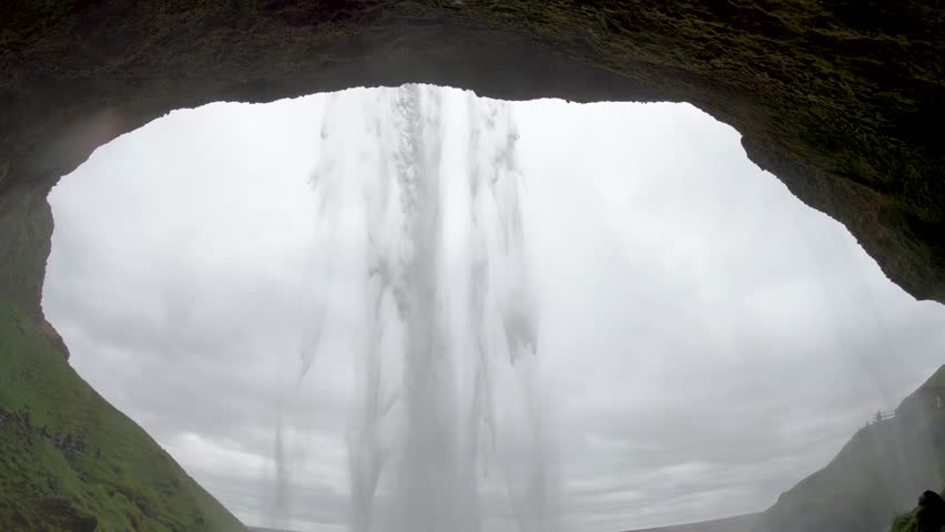  Seljalandsfoss waterfall in cloudy weather, Iceland, wet camera from water droplets