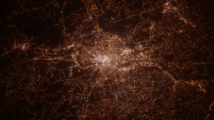 Manchester (New Hampshire, USA) top view at night. Top view on modern city with street lights and glow effect. Camera is zooming in, rotating clockwise. Vertical video. The north is on the left side