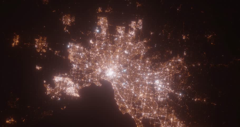 Melbourne (Australia) aerial view at night. Top view on modern city with street lights. Camera is flying above the city, moving backward