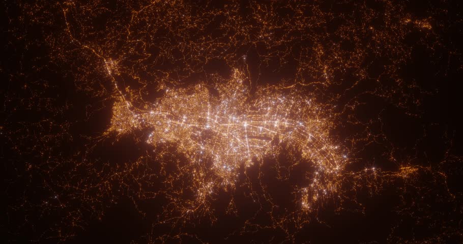 Medellin (Colombia) aerial view at night. Top view on modern city with street lights. Camera is zooming out, rotating counterclockwise. Vertical video. The north is on the left side