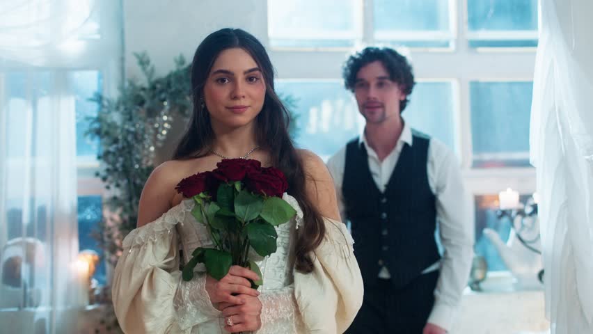 Retro date of a young couple. They sit at the table and drink wine, talk and joke. There are seafood on the table. 
They dance and watch the sunset. A beautiful young girl with a bouquet of roses. Ret