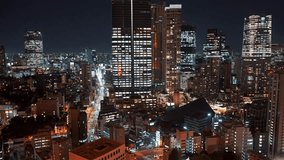 Aerial night view of Tokyo’s illuminated skyline, featuring dazzling skyscrapers, neon-lit city streets, vibrant nightlife, and the energy of Japan’s bustling metropolis from a towering perspective - Powered by Shutterstock - Get 15% off with code: PIKWIZARD15