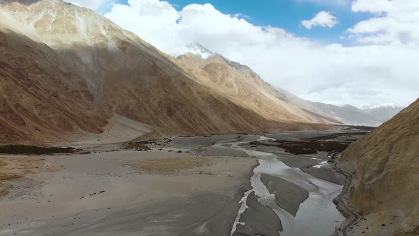 Mesmerizing journey along a road that winds through the rugged terrains of Diskit in Ladakh, India
