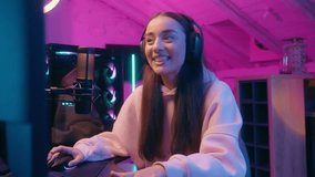 Caucasian teenager girl teenage female woman gamer streamer playing video game play gaming talking emotional stream talk streaming carefree with chat computer internet online in neon night light home - Powered by Shutterstock - Get 15% off with code: PIKWIZARD15