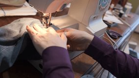 Sewing machine with female hands close-up.  - Powered by Shutterstock - Get 15% off with code: PIKWIZARD15