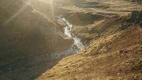 Sunny view over Iceland small river, drone shot moving forward - Powered by Shutterstock - Get 15% off with code: PIKWIZARD15