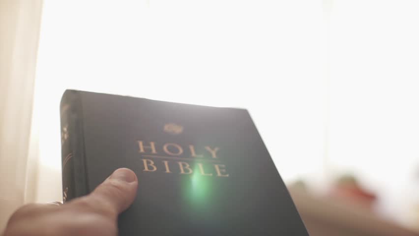 Holy bible in the rays of the sun. Christian biblical concept of wisdom from God Jesus Christ, the Gospel, studying and reading the Scriptures.