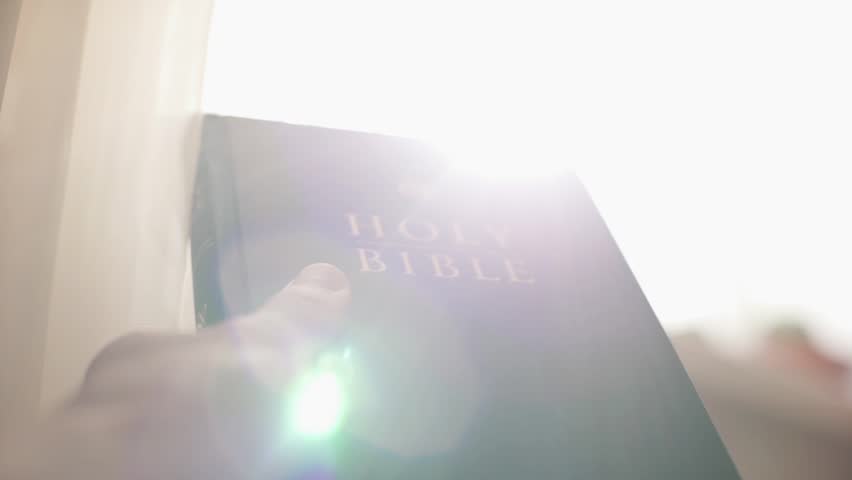 Holy bible in the rays of the sun. Christian biblical concept of wisdom from God Jesus Christ, the Gospel, studying and reading the Scriptures.