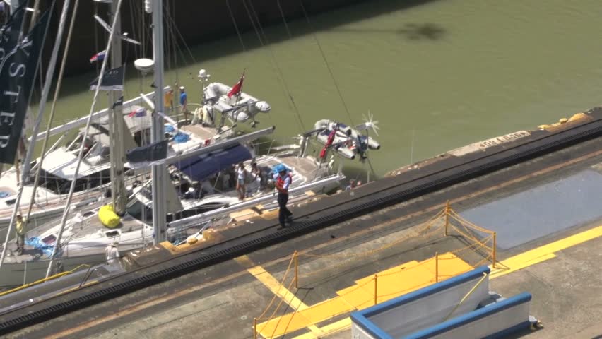 Sailboats leaving Panama Canal gate close up