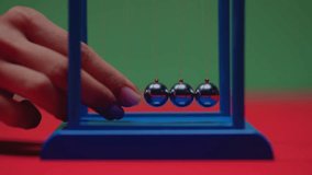  "4K Close-Up of Hand Initiating Newton’s Cradle – Physics of Motion and Energy Transfer"

 - Powered by Shutterstock - Get 15% off with code: PIKWIZARD15