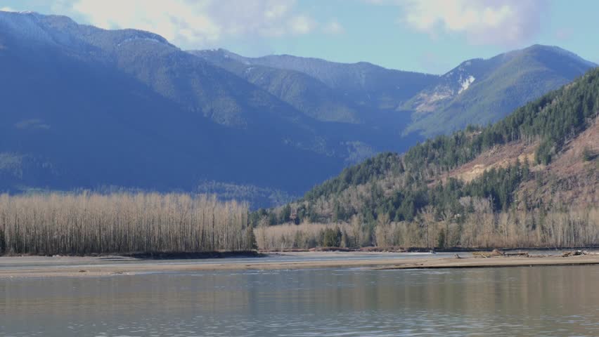 Beautiful view of the Fraser River at Island 22 Regional Park during a winter season in Chilliwack, British Columbia, Canada