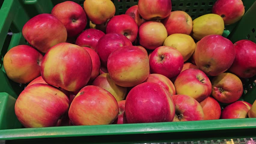many boxes with red apples