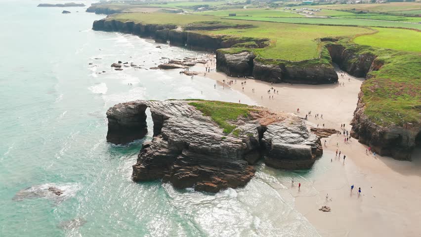 Amazing aerial view of the Playa de Las Catedrales beach in Galicia region, northern Spain. Beautiful cliff formations on famous Cathedral Beach, Cantabrian Coast 