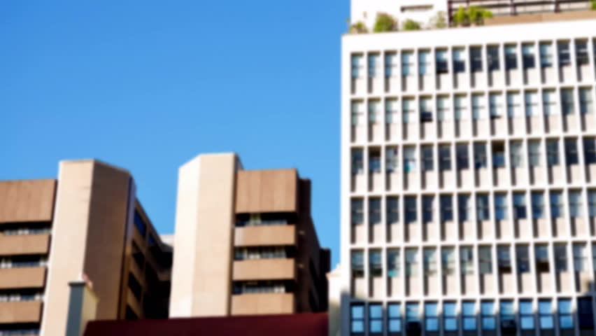 Digital notifications and data animations overlaying urban buildings against blue sky. Cityscape, technology, futuristic, digital overlay, skyline, innovation - Powered by Shutterstock - Get 15% off with code: PIKWIZARD15