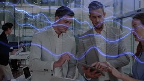 Discussing data, business professionals with digital wave animation in office setting. Technology, communication, teamwork, innovation, meeting, digital transformation - Powered by Shutterstock - Get 15% off with code: PIKWIZARD15