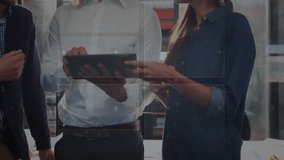 Discussing futuristic data visualization, business professionals using digital interface in office. Technology, innovation, analytics, corporate, collaboration, strategy - Powered by Shutterstock - Get 15% off with code: PIKWIZARD15